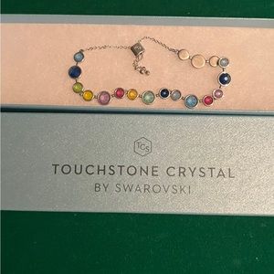 Beautiful adjustable, tri-colored bracelet its touchstone crystal by SWAROVSKI.